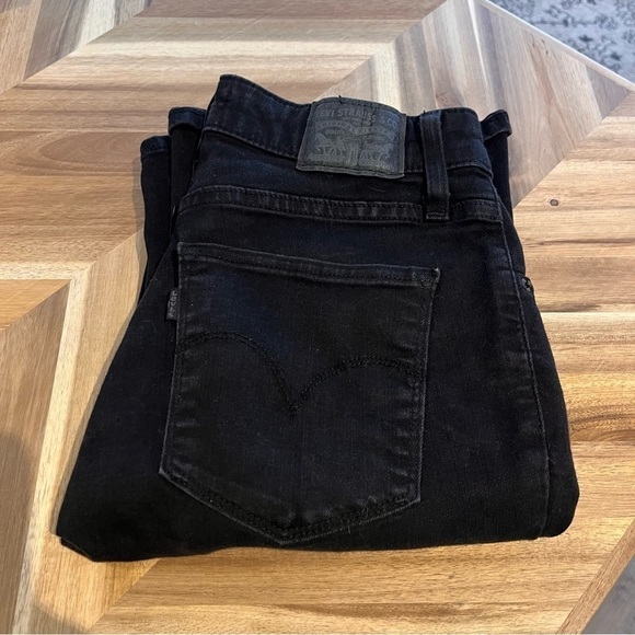 Levi's stretchy black boot cut jean size 27" inseam is 32". - Picture 3 of 9